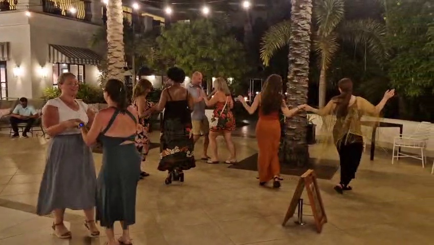 Guests dancing together during a Latin workshop in Curaçao