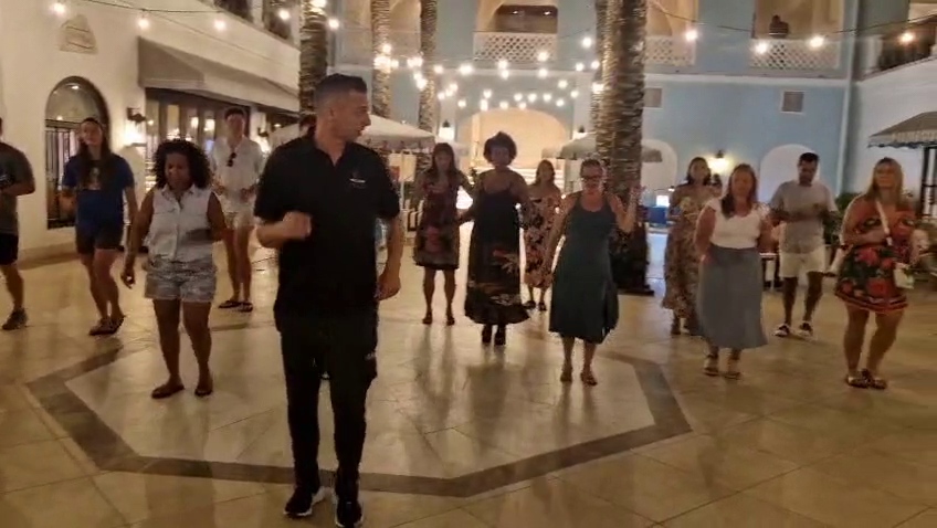 Guests joining an interactive Latin dance workshop at a luxury resort in Curaçao